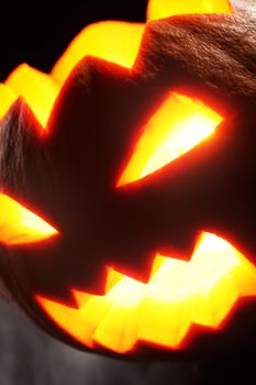 Illuminated halloween pumpkin on a black background