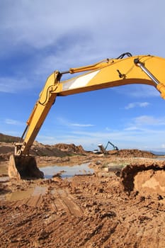 excavator loader machine during earthmoving works outdoors at construction site