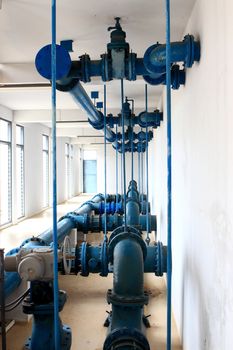 Water pumping station, industrial interior and pipes