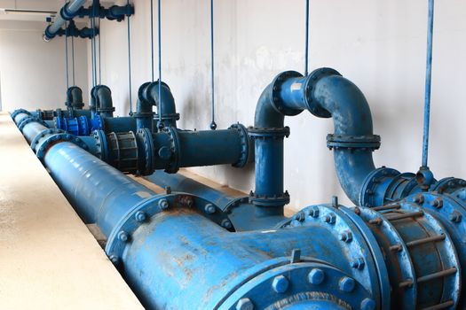 Water pumping station, industrial interior and pipes