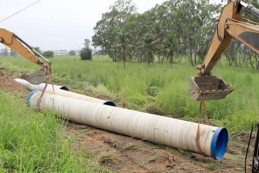 Specialized equipment for placing large diameter pipe in a trench