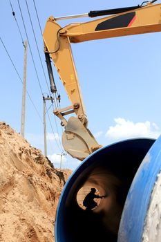 Specialized equipment for placing large diameter pipe in a trench