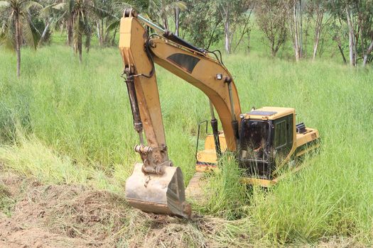 excavator loader machine during earthmoving works outdoors at construction site