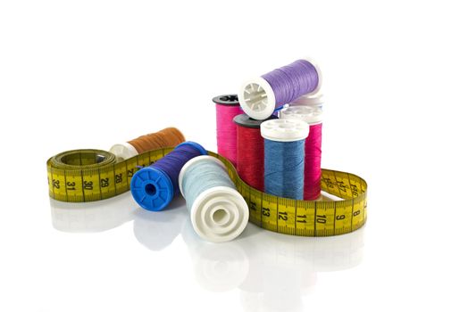sewing thread and tailor equipment isolated on white