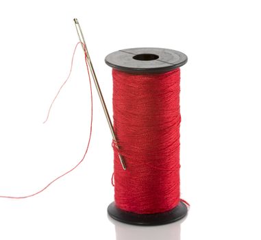 red thread cotton isolated on white