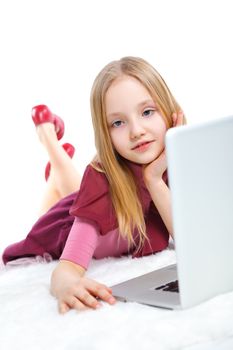 Attractive young girl using notebook computer. Isolated on white background.