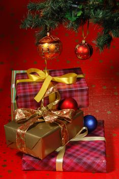 Gifts under the Christmas tree lights background