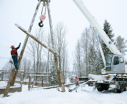 Repair power lines in winter in heavy snowfall