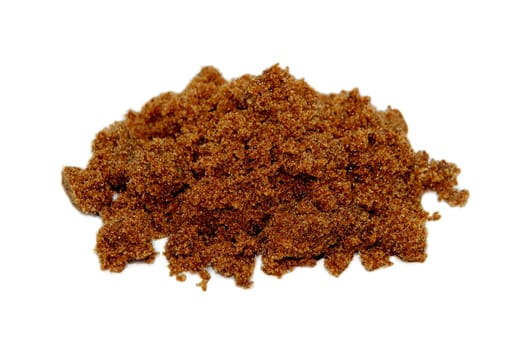 Pile of dark brown soft sugar, isolated on a white background
