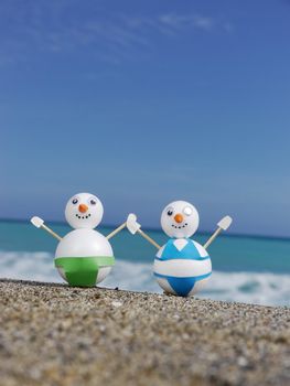 snowman beach vacation holidays from cold winter