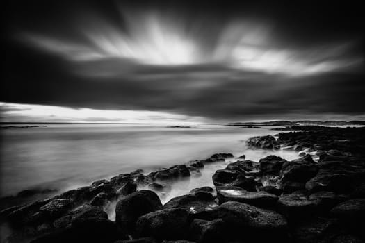 Another shot from a cold sunset shoot. Extra long exposure was used to capture the cross flowing cloud and flat sea.