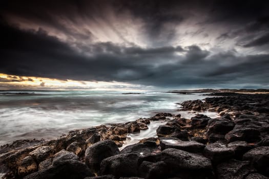 Another shot from a cold sunset shoot. Extra long exposure was used to capture the cross flowing cloud and flat sea.