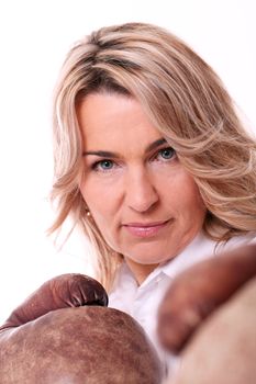 Woman with boxing gloves over white background
