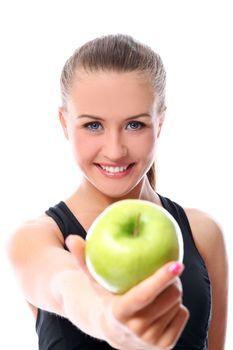 Beautiful fitness girl with green apple in hand over white background