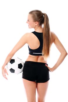 Young and sexy girl with soccer ball over white background