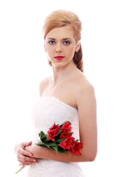 Portrait of young bride with red roses