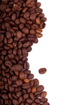 Roasted coffee beans over white background
