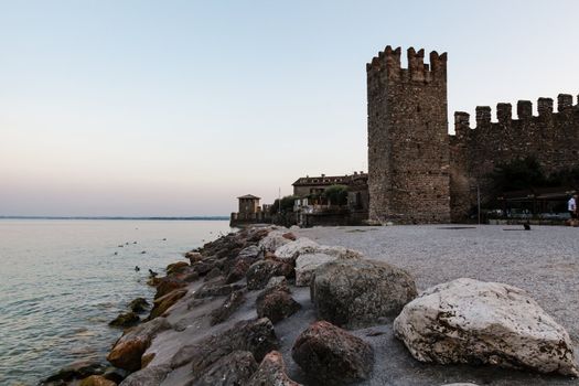 Medieval Castle on the Rocky Beach of Lake Garda in Sirmione, Northern Italy