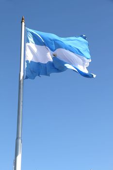 The Argentine Flag on blue sky.