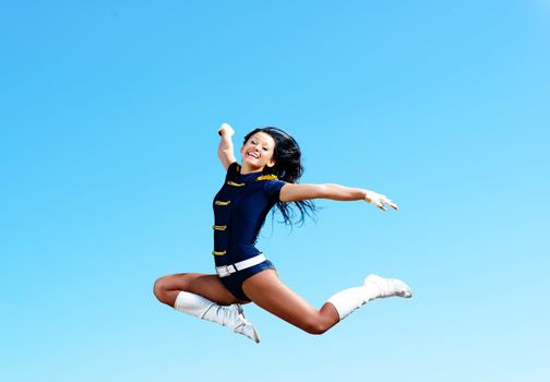 dancer jumping on a background of blue sky