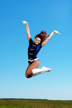 dancer jumping on a background of blue sky