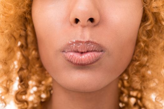 lips of a young woman is very close