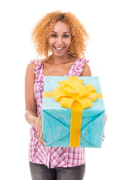 Cheerful woman holding a gift bag. Portrait on a white background.