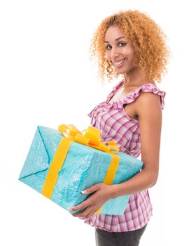 Cheerful woman holding a gift bag. Portrait on a white background.