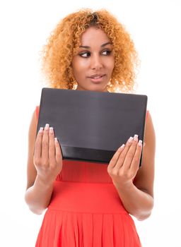 young woman in a red dress holding a laptop