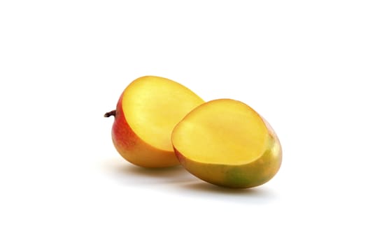 Fresh mangos photographed on a white background.
