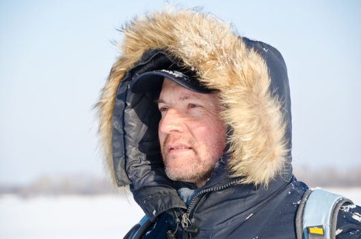 Portrait of a traveler in winter clothes in an outdoor