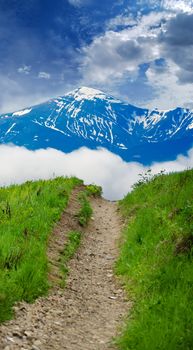 footpath on the hill amid the scenic sky