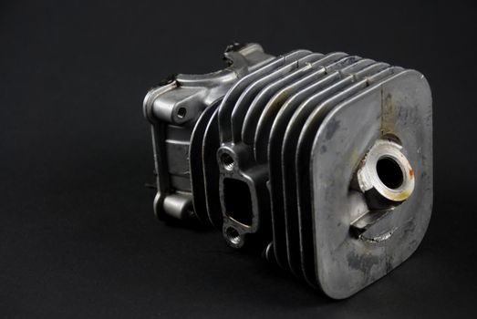 Stock pictures of a small gas engine and a carburetor