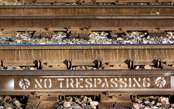 Train Tracks Warn No Trespassing