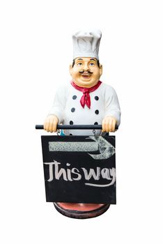 Fat plastic male chef doll holding a sign, isolated in white