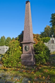 on the os cemetery in halden, there are several old grave monuments, image is shot inside the cemetery.