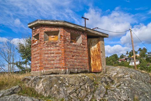an old disused transformer that stands at the top of a mountain in halden