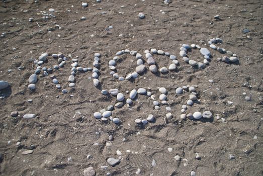 RHODOS 2012 (Rhodes), written with stones on the beach at Sunbeach Hotel. Image is shot on vacation in Rhodes autumn 2012.
