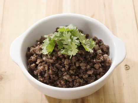 close up of a bowl of minced beef