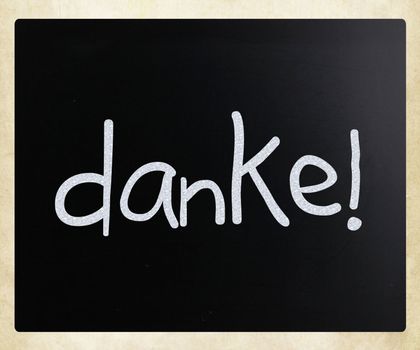 "Danke!" handwritten with white chalk on a blackboard.
