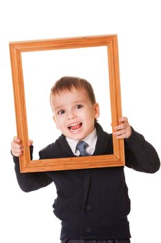 Funny caucasian boy, holding a wooden picture frame. Isolated on white background 