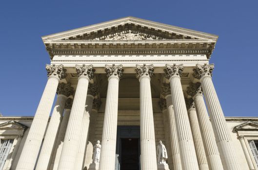 front of courthouse, justice symbol