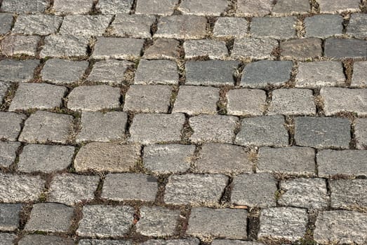 Granite gray town pavement close-up as background