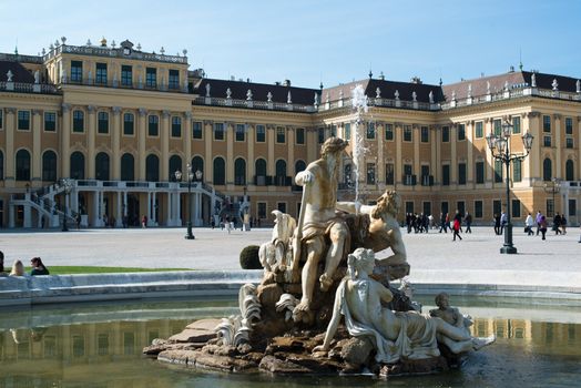 VIENNA - OCTOBER 4: Visitors approaching the Schoenbrunn Palace, a UNESCO World Heritage Site on October 4, 2012 in Vienna, Austria. The Schoenbrunn Palace was built between 1638 and 1643 and is now one of the major tourist attractions in Vienna.