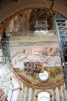 VIENNA - OCTOBER 5: The St. Charles' Church (Karlskirche) in Vienna is undergoing major renovations on October 5,2012 in Vienna, Austria . As a benefit for its visitors, a comfortable elevator plus additional 120 stairs lead to the highest point of the church, bringing the visitor very close to the frescos and architecture of the church.