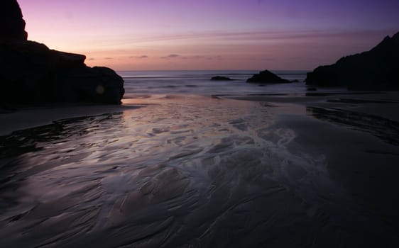 Night shot in the South of England with the moon reflecting on the still sea