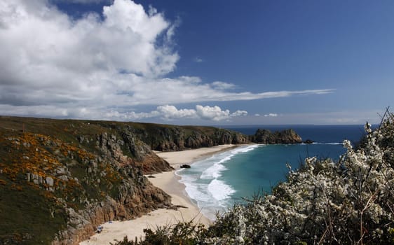On top of the cliff looking down at Porthcurno bay