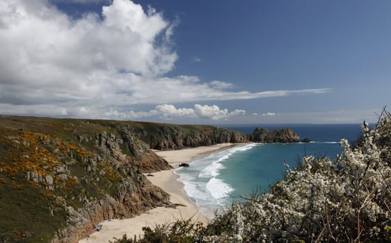 On top of the cliff looking down at Porthcurno bay