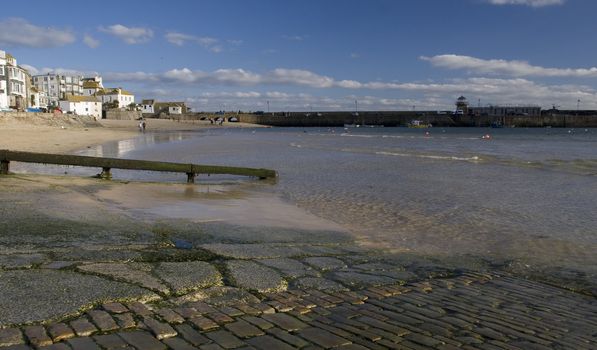 Water lapping up onto the beach at St Ives