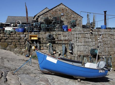 Fishing boat out of water near to lobster pots